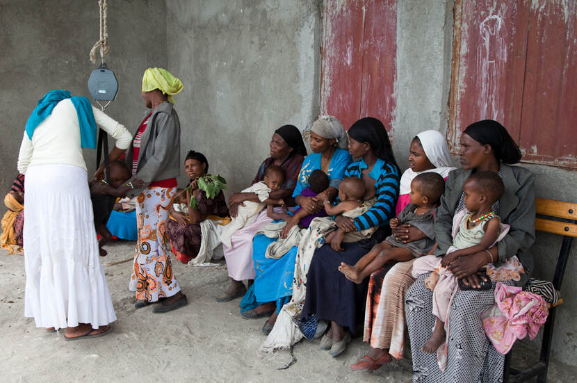 Moms weigh their babies in Oromia, Ethiopia.